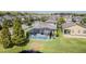 Aerial view of house with pool, near a lake at 19501 Sea Myrtle Way, Tampa, FL 33647