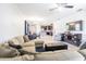 Spacious living area boasts a sectional sofa and hardwood floors with kitchen views at 19501 Sea Myrtle Way, Tampa, FL 33647