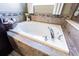 Relaxing bathroom with a large soaking tub and modern tile work at 19501 Sea Myrtle Way, Tampa, FL 33647