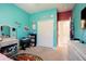 bedroom with a twin bed, built-in shelving, and teal walls at 19501 Sea Myrtle Way, Tampa, FL 33647