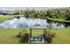 Community gazebo with seating near a pond at 19501 Sea Myrtle Way, Tampa, FL 33647