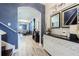 Bright entryway with white dresser, mirrors, and view into dining area at 19501 Sea Myrtle Way, Tampa, FL 33647