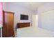 Relaxing bedroom with a queen bed, wooden dresser, and calming decor at 19501 Sea Myrtle Way, Tampa, FL 33647