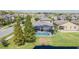 Aerial view of house, pool and cabana, and surrounding neighborhood at 19501 Sea Myrtle Way, Tampa, FL 33647