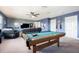 Fun game room featuring a pool table, comfortable seating, and a large TV at 19501 Sea Myrtle Way, Tampa, FL 33647