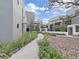Landscaped courtyard with brick pathways and modern building exteriors at 3030 W Santiago St # 4, Tampa, FL 33629