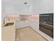 Modern kitchen with white cabinets, marble countertops and gold accents at 3030 W Santiago St # 4, Tampa, FL 33629