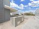 Outdoor kitchen with grill and sink, perfect for entertaining at 3030 W Santiago St # 4, Tampa, FL 33629