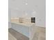 Modern kitchen with white cabinets and marble countertops at 3030 W Santiago St # 4, Tampa, FL 33629