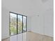 Spacious bedroom with large windows and light wood floors at 3030 W Santiago St # 4, Tampa, FL 33629