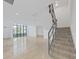 Modern staircase with metal railing and tile flooring at 3030 W Santiago St # 4, Tampa, FL 33629
