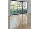 Bright living room featuring large sliding glass doors and hardwood floors at 3030 W Santiago St # 4, Tampa, FL 33629
