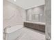 Primary bathroom with soaking tub and walk-in shower at 3030 W Santiago St # 4, Tampa, FL 33629