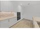 Modern kitchen with white cabinets, marble countertops, and gold hardware at 3030 W Santiago St # 4, Tampa, FL 33629