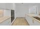 Modern kitchen with white cabinets, marble countertops, and high-end appliances at 3030 W Santiago St # 4, Tampa, FL 33629