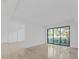 Open concept living space with large windows and tile floors at 3030 W Santiago St # 4, Tampa, FL 33629