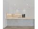 Modern kitchen with white cabinets and large marble island at 3030 W Santiago St # 4, Tampa, FL 33629