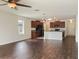 Open concept living room with kitchen and hardwood floors at 2110 Purple Orchid Pl, Ruskin, FL 33570