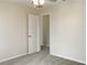 Bedroom with ceiling fan and access to another room at 2110 Purple Orchid Pl, Ruskin, FL 33570