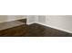 Dark hardwood and light tile flooring combination at 2110 Purple Orchid Pl, Ruskin, FL 33570