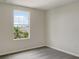 Bedroom with a large window offering an outdoor view at 2110 Purple Orchid Pl, Ruskin, FL 33570