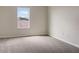 Bright bedroom with grey carpet and a large window at 2110 Purple Orchid Pl, Ruskin, FL 33570