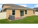 Back of house showing patio, AC units and fenced yard at 2110 Purple Orchid Pl, Ruskin, FL 33570