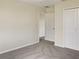 Bedroom with double door closet and access to another room at 2110 Purple Orchid Pl, Ruskin, FL 33570
