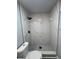 Updated bathroom with marble-look shower at 504 Maydell Dr, Tampa, FL 33619
