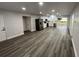 Open concept living and kitchen area with grey vinyl flooring at 504 Maydell Dr, Tampa, FL 33619