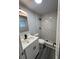 Updated bathroom with marble-look shower and modern vanity at 504 Maydell Dr, Tampa, FL 33619