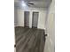 Bright bedroom with grey vinyl flooring and double closets at 504 Maydell Dr, Tampa, FL 33619