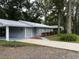 Newly renovated home with a carport and landscaped yard at 504 Maydell Dr, Tampa, FL 33619