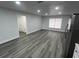 Bright and spacious living room with wood-look flooring at 504 Maydell Dr, Tampa, FL 33619