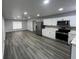 Modern kitchen with stainless steel appliances and white cabinets at 504 Maydell Dr, Tampa, FL 33619