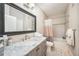 Clean bathroom with a tub shower combo, updated vanity and tile floors at 5000 Culbreath Key Way # 1-212, Tampa, FL 33611