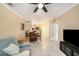 Bright living room features tile floors and a view into the kitchen and dining area at 5000 Culbreath Key Way # 1-212, Tampa, FL 33611