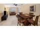 Well-lit dining area with seating for four and a view of the living room at 5000 Culbreath Key Way # 1-212, Tampa, FL 33611
