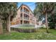 Exterior of a building with a white fence and palm trees at 5000 Culbreath Key Way # 1-212, Tampa, FL 33611