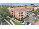 Aerial view of an apartment building with ample parking and landscaped grounds at 5000 Culbreath Key Way # 1-212, Tampa, FL 33611