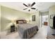 Spacious bedroom with a ceiling fan and en-suite bathroom access at 5000 Culbreath Key Way # 1-212, Tampa, FL 33611