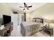 Comfortable bedroom with a ceiling fan and private access to a balcony at 5000 Culbreath Key Way # 1-212, Tampa, FL 33611