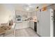 Kitchen features white cabinets, black appliances, and tiled floor at 2358 Ecuadorian Way # 56, Clearwater, FL 33763