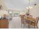 Open concept living and dining area with ample natural light at 2358 Ecuadorian Way # 56, Clearwater, FL 33763