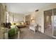 Living room with futon and access to other rooms and a balcony at 2358 Ecuadorian Way # 56, Clearwater, FL 33763