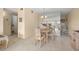 Charming dining room with table and chairs, mirror reflecting living room at 2358 Ecuadorian Way # 56, Clearwater, FL 33763