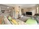 Living area with futon, a view into kitchen, and a glass-top table at 2358 Ecuadorian Way # 56, Clearwater, FL 33763