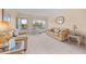 Living room with light beige couches and carpet at 2358 Ecuadorian Way # 56, Clearwater, FL 33763