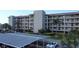 Three-story condo building with parking and landscaping at 8141 Aquila St # 315, Port Richey, FL 34668