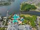 Aerial image of the community pool and amenities, with palm trees and water view at 415 Islebay Dr, Apollo Beach, FL 33572